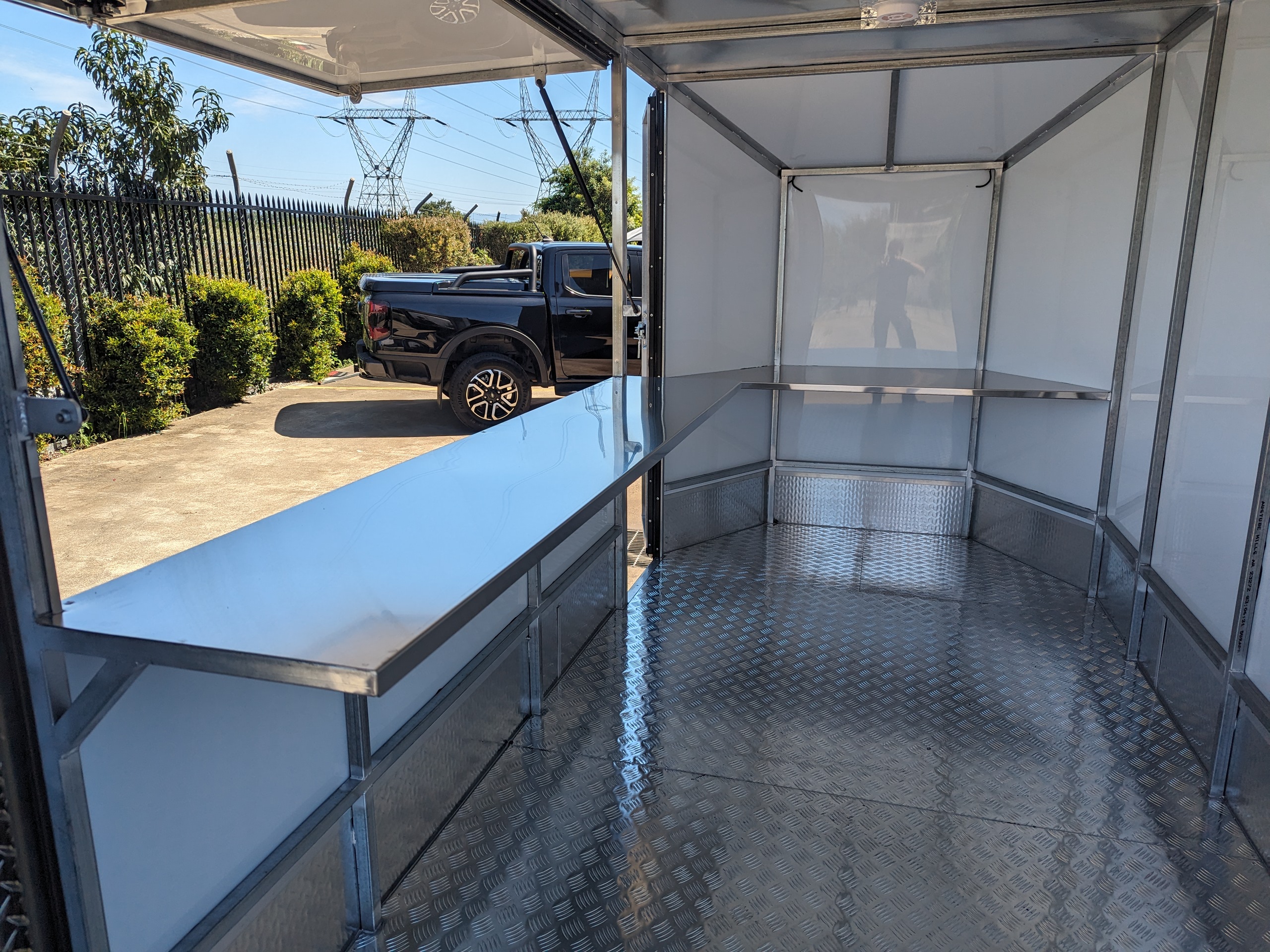 Drone storage and workshop trailer - rear ramp, side access door, benches